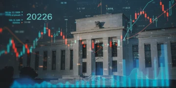 Federal Reserve building with financial charts, representing 2026 interest rate projections and economic outlook.