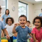 Children happily engaged in activities at a modern, safe child care center, illustrating the positive impact of child care assistance.